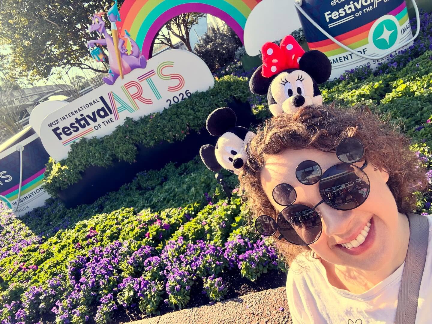 Abigail Haggard selfie at EPCOT International Festival of the Arts 2026 with Minnie Mouse plush ears