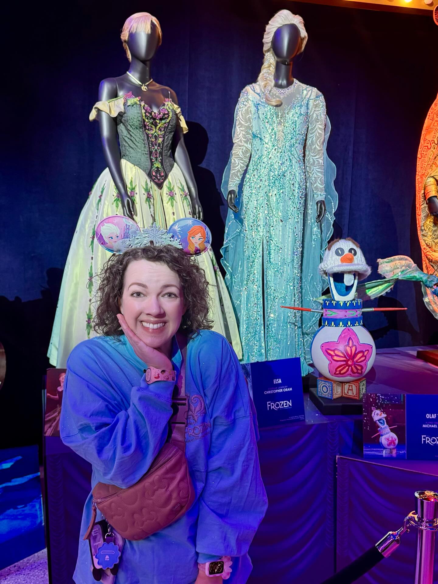 Abigail Haggard at a Frozen costume exhibit wearing Frozen spirit jersey and Elsa ears